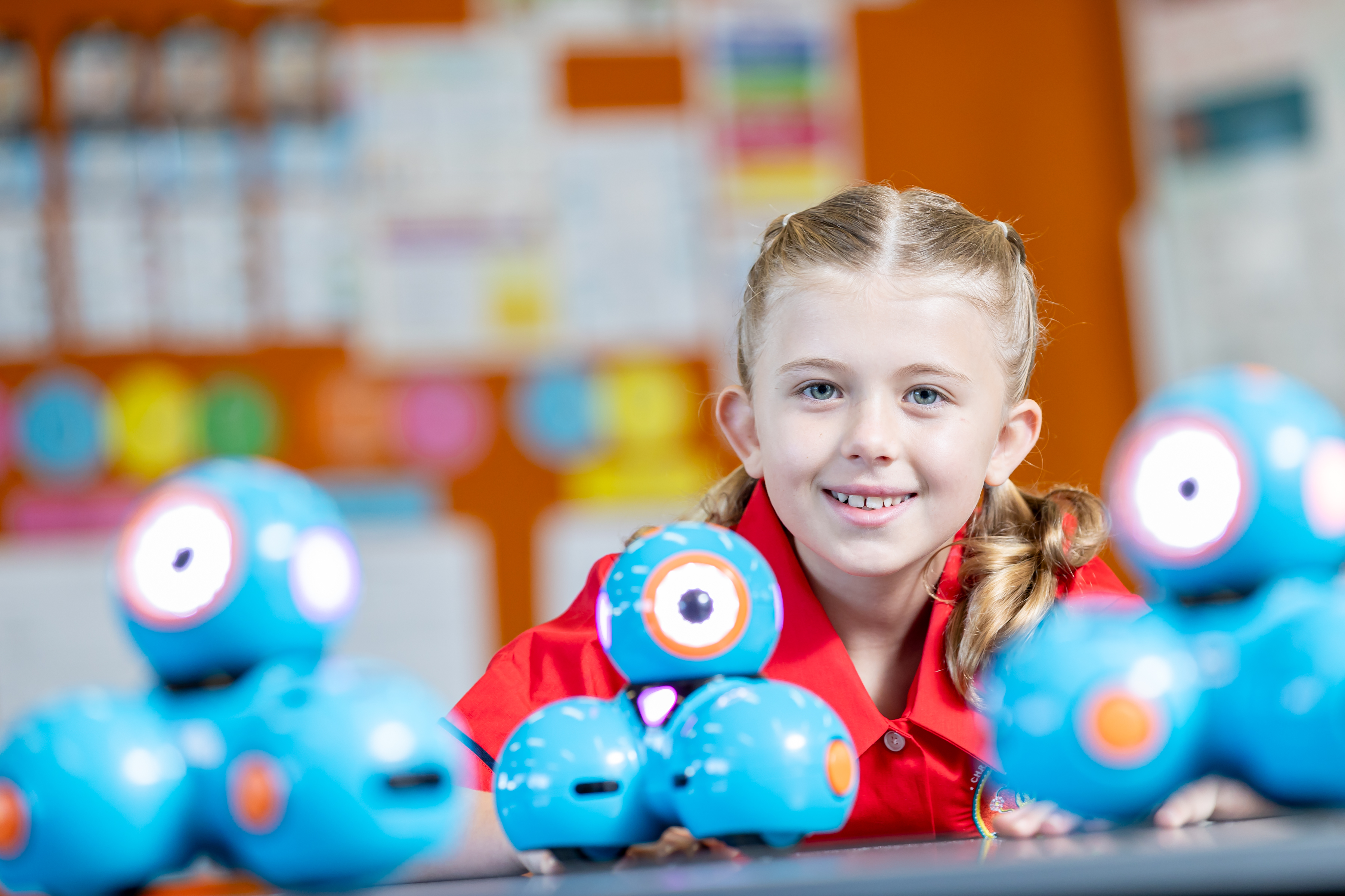 Student engaging with robotics tools in a classroom supporting digital skills problem solving and innovation