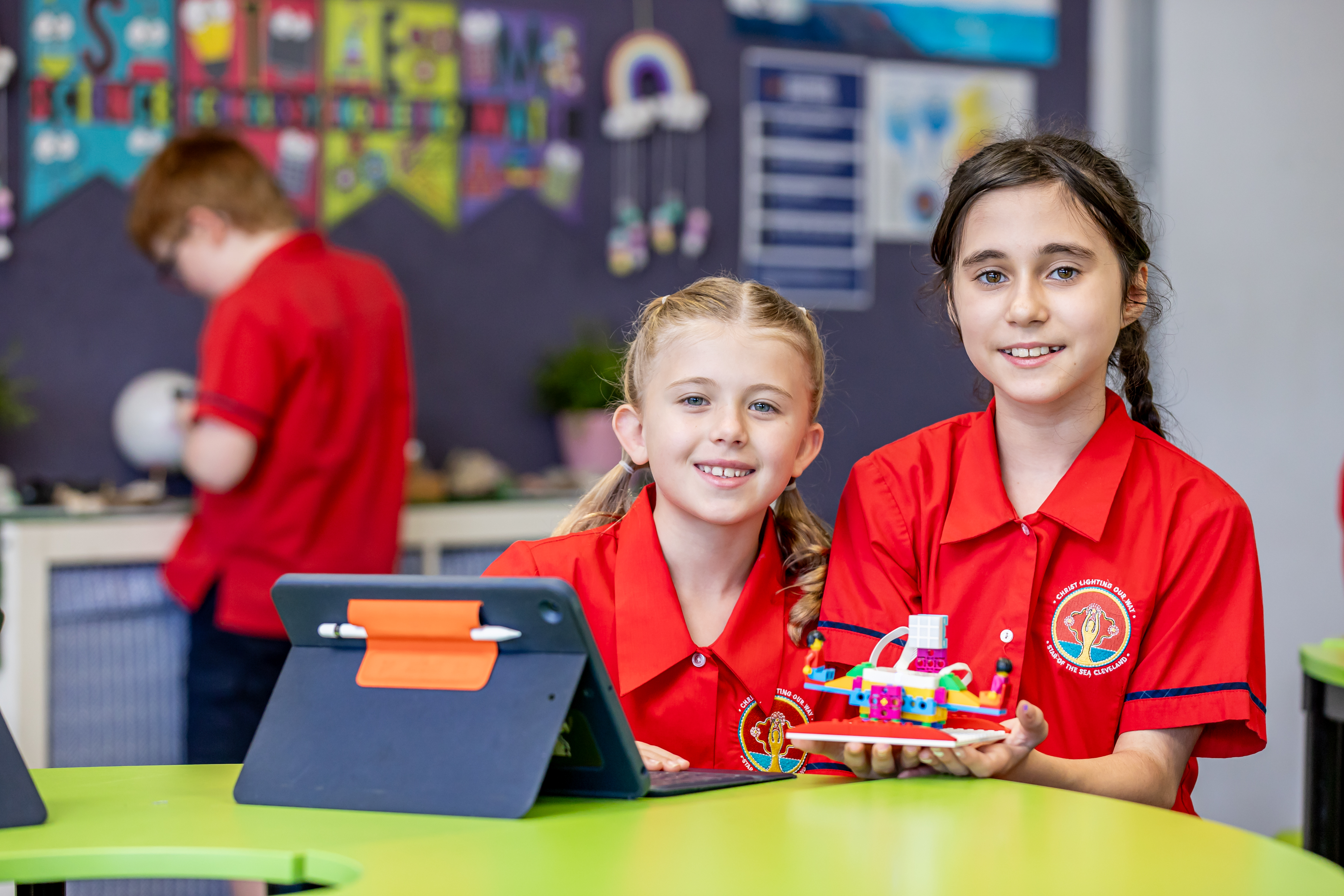 Students collaborating with digital tools and hands on materials in a classroom setting supporting creativity problem solving and active learning